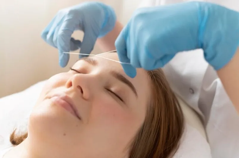 Professional eyebrow threading at NY Brows in Financial District, New York